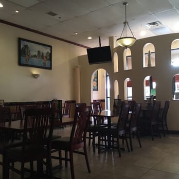 Noodle Saigon - Interior, beautiful portraits of Vietnamese landmarks on the walls. - Vietnamese Near Me - Naples, Florida