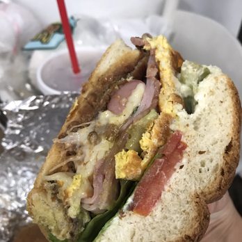 Carnitas Michoacanas - a person holding a sandwich - Mexican Near Me - Panorama City, California Carnitas Michoacanas - a person holding a sandwich - Mexican Near Me - Panorama City, California