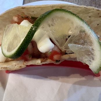 Maine Day Ventures - seasoned, grilled fresh haddock with house-made pickled vegetables, pico de gallo and lime crema in a corn tortilla at Andy's Old Port Pub - Food Tours Near Me