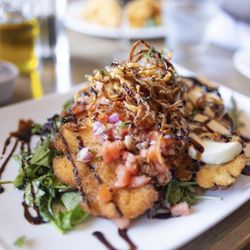 Chicken Milanese - Chicken cutlet topped with bruschetta, fresh mozzarella and crispy onions served over mesclun lettuce