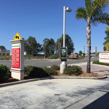 7-Eleven - a parking lot with a sign and palm trees - Gas Stations Near Me - San Marcos, California 7-Eleven - a parking lot with a sign and palm trees - Gas Stations Near Me - San Marcos, California