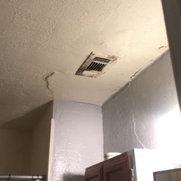 Bathroom vent, all the ceiling throughout the house was cracked in this manner, again, a deeper problem than just repainting