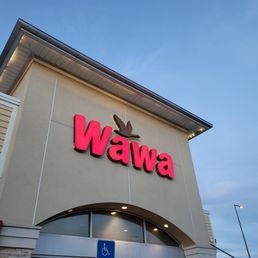 Exterior outside entrance of Wawa - Kissimmee, Florida Exterior outside entrance of Wawa - Kissimmee, Florida
