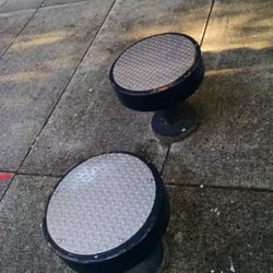 Goose Hollow / SW Jefferson St MAX Station - Seating near the Oregonian is in the shapes of punctuation