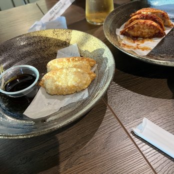 Sushi Mugen - Gyoza spicy in back and non spicy in the front. Go for the non spicy! - Sushi Bars Near Me - Vancouver, British Columbia Sushi Mugen - Gyoza spicy in back and non spicy in the front. Go for the non spicy! - Sushi Bars Near Me - Vancouver, British Columbia