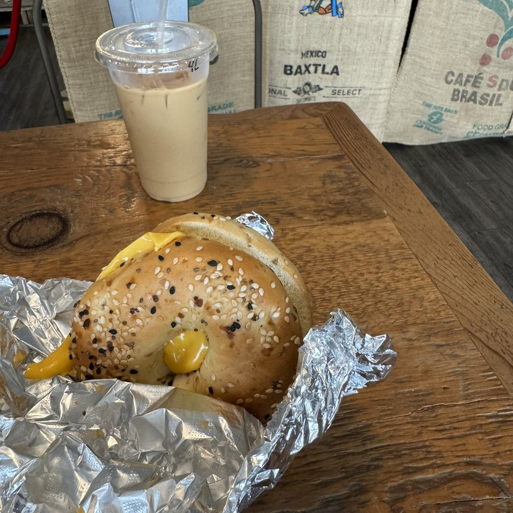 Malone Specialty Coffee - Four Leaf Clover and Bacon egg and cheese bagel - Coffee Roasteries Near Me - Austin, Texas Malone Specialty Coffee - Four Leaf Clover and Bacon egg and cheese bagel - Coffee Roasteries Near Me - Austin, Texas