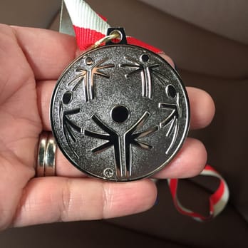 Illinois Wesleyan University - Front Of A Silver Medal - Colleges & Universities Near Me - Bloomington, Illinois