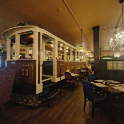 The Old Spaghetti Factory - There are tables inside of the cable car
