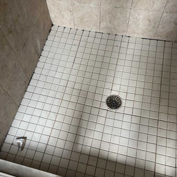 Tough Builders - Before water leaking under shower pan caused mold to grow under tile/caulking. - Flooring Near Me Tough Builders - Before water leaking under shower pan caused mold to grow under tile/caulking. - Flooring Near Me