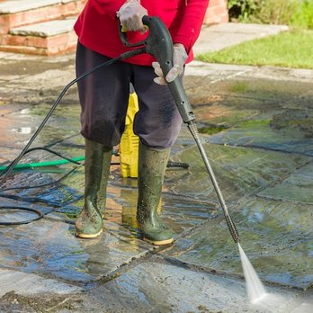 AFG General Contractors - a woman using a pressurer - General Contractors Near Me - Vancouver, British Columbia