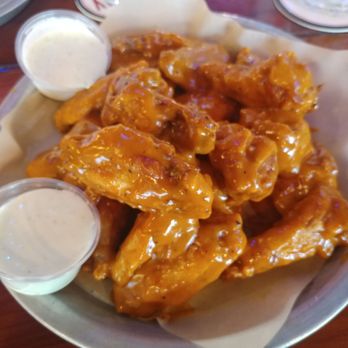 Hooters - Naked wings with spicy garlic are the way to go. They never let me down at Hooters, food was excellent. - American Near Me - Tucson, Arizona
