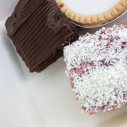 The Village Bakery - Chocolate fudge, coconut and raspberry, and cherry bakewell