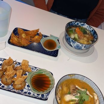 Asian Joint - Thai Chinese Cuisine - Tom Yum Soup Chicken wontons  Wonton soup  Money bags - Chinese Near Me - Fairfax, Virginia