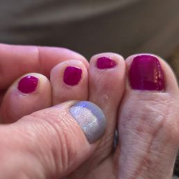 Directly after my service. Unevenly cut nails, uneven lengths, huge smudge on the big toe, unmoisturized feet.