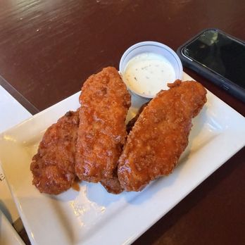 The Gulf Club - Chicken tenders, tossed in hot buffalo (full portion) - Beer Bar Near Me - Destin, Florida The Gulf Club - Chicken tenders, tossed in hot buffalo (full portion) - Beer Bar Near Me - Destin, Florida