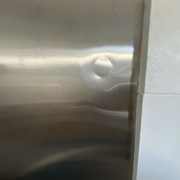 Bought 2 stainless steel sheets for my kitchen backsplash. Both sheets had huge dent. Bought 2 stainless steel sheets for my kitchen backsplash. Both sheets had huge dent.