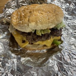a hamburger wrapped in aluminum foil a hamburger wrapped in aluminum foil