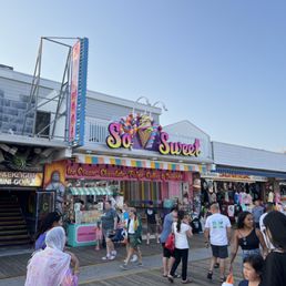 people walking on a boardwalk