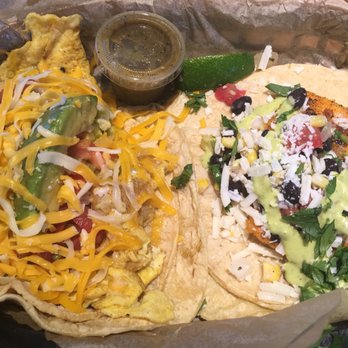 Torchy's Tacos - (Left) Migas: green chili, avocado, pico de gallo, cheddar cheese. (Right) Mr. Orange: blackened salmon, corn, black beans, cotija cheese. - Tacos Near Me - Tulsa, Oklahoma Torchy's Tacos - (Left) Migas: green chili, avocado, pico de gallo, cheddar cheese. (Right) Mr. Orange: blackened salmon, corn, black beans, cotija cheese. - Tacos Near Me - Tulsa, Oklahoma