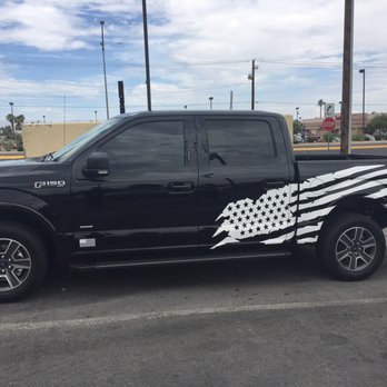 Proffiti Signs & Graphics - White flag on black truck. - Signmaking Near Me - Henderson, Nevada Proffiti Signs & Graphics - White flag on black truck. - Signmaking Near Me - Henderson, Nevada
