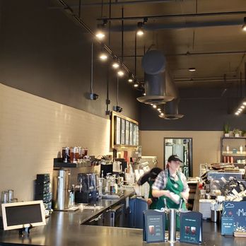 Starbucks - a man working behind the counter in a coffee shop - Coffee & Tea Near Me - Kendall, Florida Starbucks - a man working behind the counter in a coffee shop - Coffee & Tea Near Me - Kendall, Florida