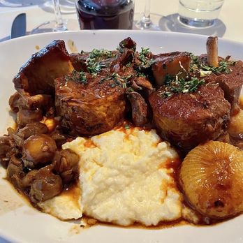Poggio Trattoria - Pork Osso bucco w/cippolini onion, marsala sautéed baby mushrooms, polenta - Italian Near Me - Sausalito, California Poggio Trattoria - Pork Osso bucco w/cippolini onion, marsala sautéed baby mushrooms, polenta - Italian Near Me - Sausalito, California