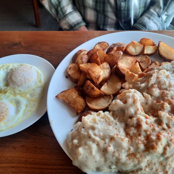 McKay Cottage Restaurant - Massive order of scone biscuits and gravy with a side of eggs. - American Near Me - Bend, Oregon