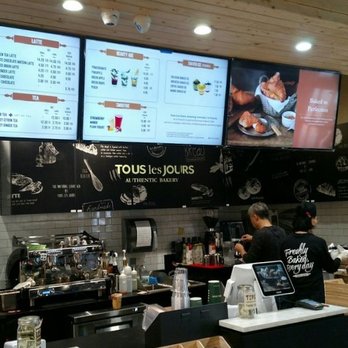 Tous Les Jours - Partial view of the menu screens and service counter - Bakeries Near Me - San Diego, California Tous Les Jours - Partial view of the menu screens and service counter - Bakeries Near Me - San Diego, California
