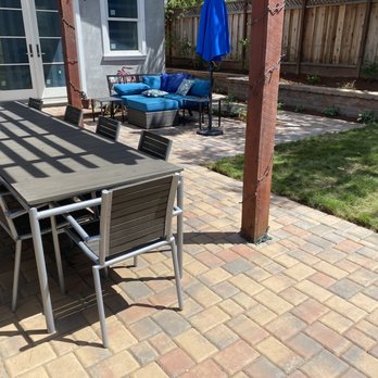 Zazueta Landscape - a patio with a table and chairs - Landscaping Near Me Zazueta Landscape - a patio with a table and chairs - Landscaping Near Me