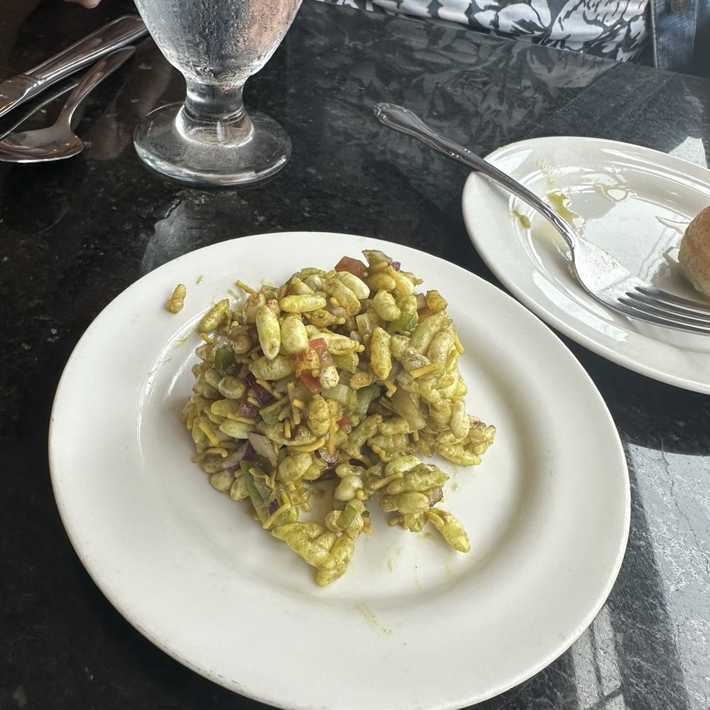 Bombay Bistro - One of the appetizers.  Tasted like puffed rice with onion. Delish. - Indian Near Me - Rockville, Maryland