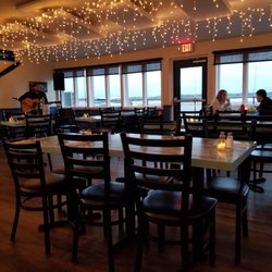 Pilots Cove Cafe - Dining Room overlooking the Air field. Deck is open in the warmer weather.