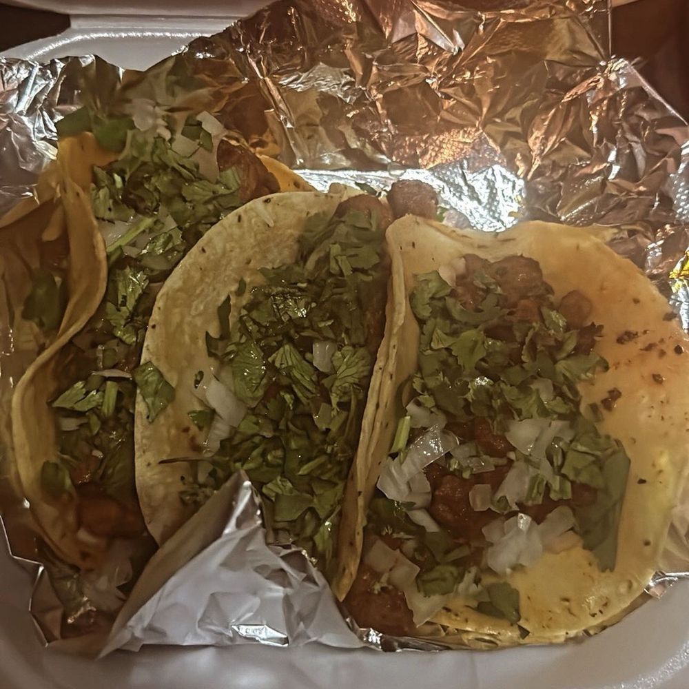 El Patio Catracho - a tray of tacos on a table - Food Trucks Near Me - Jacksonville, Florida