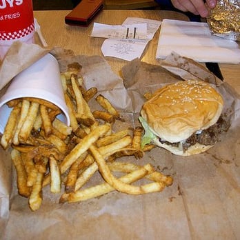 Five Guys - a hamburger and french fries on a table - Fast Food Near Me - Dickson City, Pennsylvania