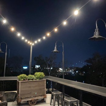 The Lookout - a deck with a planter and lights - Cocktail Bars Near Me - Tuscaloosa, Alabama The Lookout - a deck with a planter and lights - Cocktail Bars Near Me - Tuscaloosa, Alabama