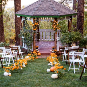 Cakewalk Heirloom Baking - Jennifer decorated this gazebo area in Lillaskog with floral arrangements, pumpkins and wooden chairs - Cafes Near Me - Coulterville, California