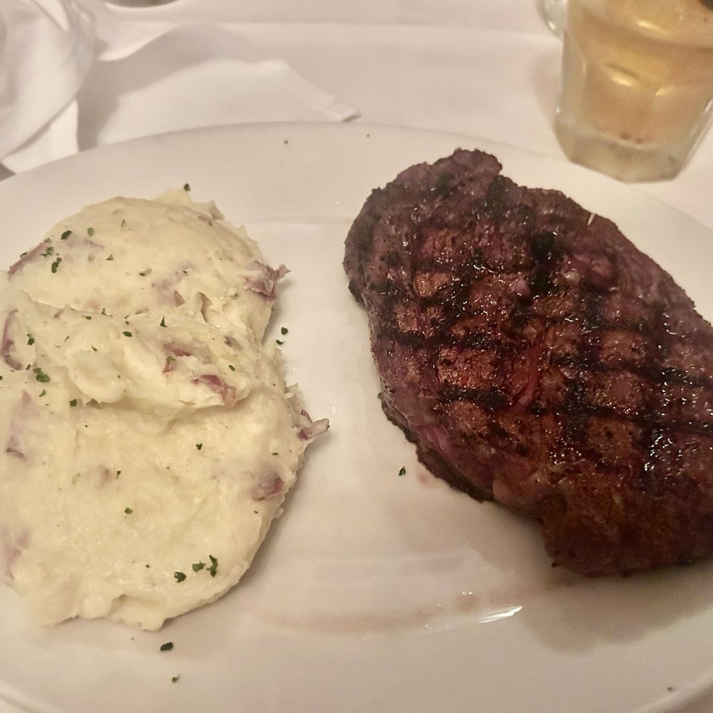 St. Elmo Steak House - Medium Rare Ribeye w/Mashed Potatoes - Steakhouses Near Me - Indianapolis, Indiana St. Elmo Steak House - Medium Rare Ribeye w/Mashed Potatoes - Steakhouses Near Me - Indianapolis, Indiana