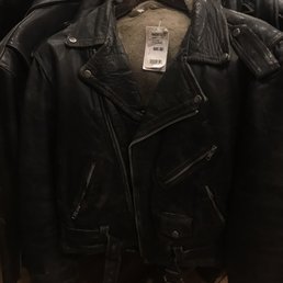 $85 dollars, collar had leather completely worn through and the inside lining was a soiled brown color.