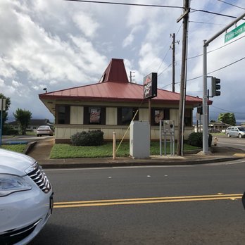 Pizza Hut - a white car driving down the street - Pizza Near Me - Lihue, Hawaii