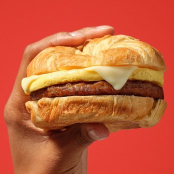 Circle K - a hand holding a sausage sandwich - Convenience Stores Near Me - Frisco, Texas
