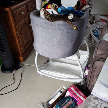 Pacific Moving Services - Bassinet overstuffed with collectibles that are not wrapped - Movers Near Me - Carmichael, California