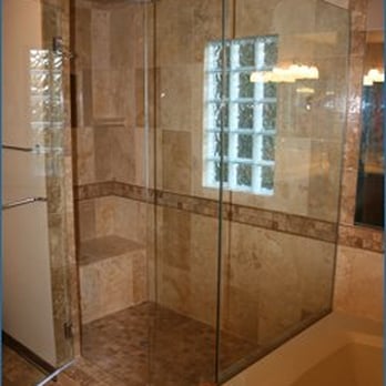 Krueger Renovations - a shower with a glass door - General Contractors Near Me