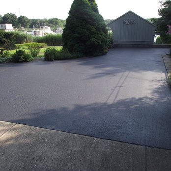 Seal of Approval - a paved driveway in a residential area - General Contractors Near Me - Wading River, New York Seal of Approval - a paved driveway in a residential area - General Contractors Near Me - Wading River, New York