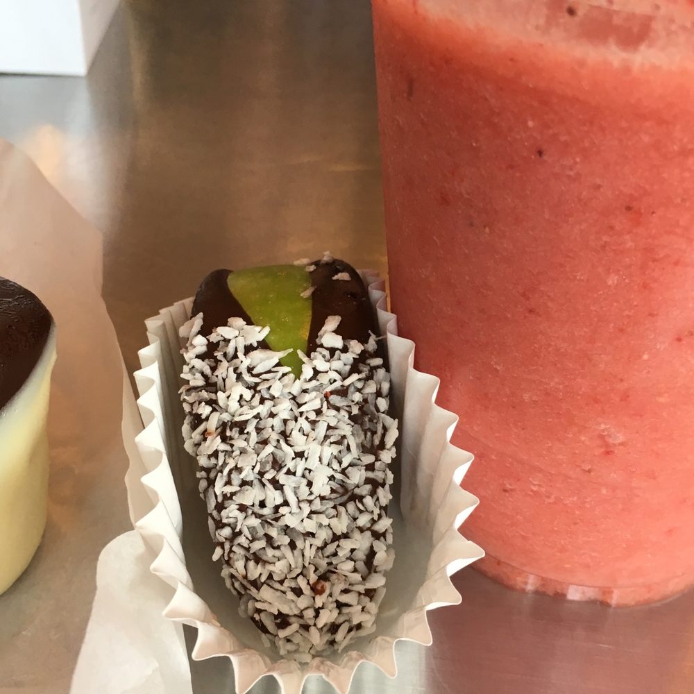 a chocolate covered strawberry and a smoothie