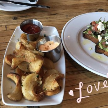 Industry Kitchen - Wood Oven Potato Curls & Avocado Toast - American Near Me - New York, New York Industry Kitchen - Wood Oven Potato Curls & Avocado Toast - American Near Me - New York, New York