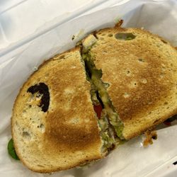 Chicken artichoke melt with avocado and egg