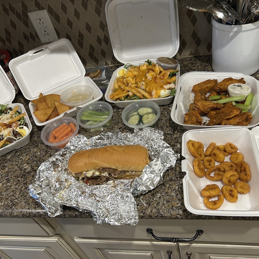 Kelly's Side Door Tavern - Steak and chicken salad, dry Cajun wings, fried hot pepper rings a Philly steak sandwich and hummus and veges - Irish Pub Near Me - New Castle, Pennsylvania