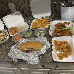 Kelly's Side Door Tavern - Steak and chicken salad, dry Cajun wings, fried hot pepper rings a Philly steak sandwich and hummus and veges