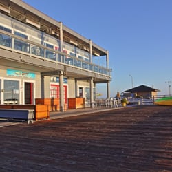 Adventures By The Sea - The morning Sun on the front of our shop.