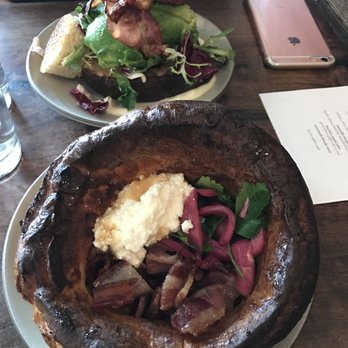 Outerlands - The eggs in jail (background) and the savory Dutch pancake with fresh ricotta. DELICIOUS! - New American Near Me - San Francisco, California