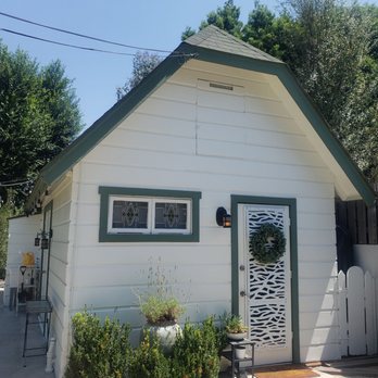 Gradient Colors - a white house with green trim - Painters Near Me